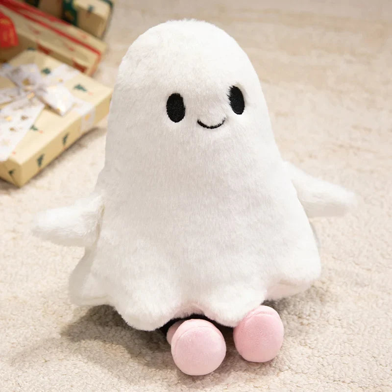 White plush ghost toy with pink feet on a beige carpet